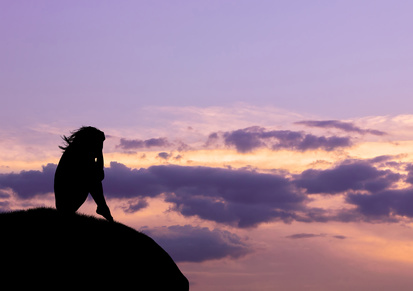 Silhouette on a hill